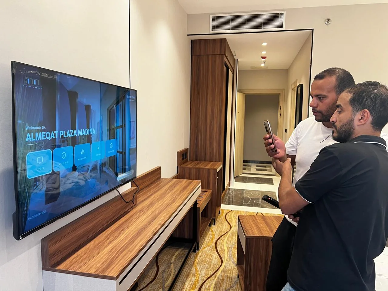 Yanbu hotel, port and staff-housing reference showing hotel Guest Room IPTV Welcome Screen Setup - Al Meaqat Plaza Madinah
